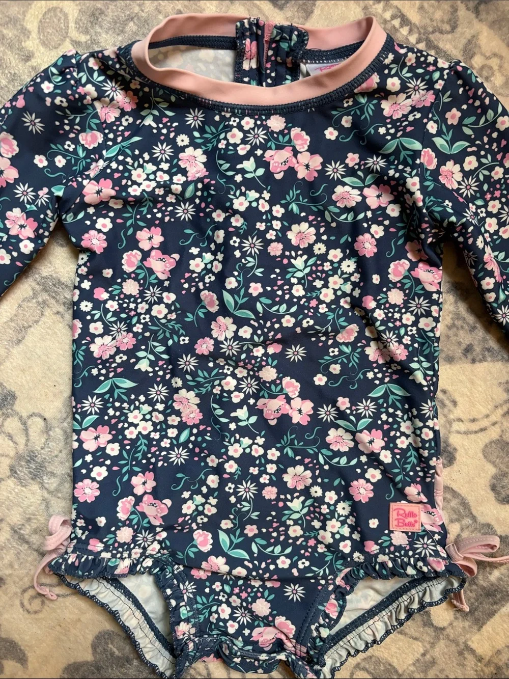 Ruffle Butts Navy Floral One-Piece Swimsuit with Pink Trim